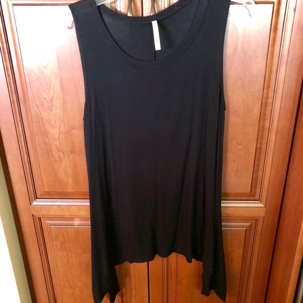 Cute black sleeveless top with interesting hemline
